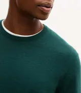 Suéter de punto para hombre, con cuello redondo, mangas largas y puños y bajo acanalados.