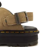 Zapatos tipo zueco Dr. Martens modelo Zebzag, color marrón, de gamuza, con suela chunky acanalada y costura amarilla distintiva. Cuenta con tira ajustable con hebilla metálica.