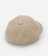 Boina color beige confeccionada en tweed con visera curva.