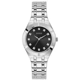 Reloj analógico Guess con caja de 36 mm de acero inoxidable plateado y esfera negra con marcadores de hora tipo cristal. Presenta una malla de acero inoxidable con acabado pulido y movimiento de cuarzo.