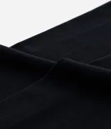 Media legging de fleece color negro, sin estampa y con pie abierto.