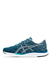 Championes deportivos Asics modelo Streetwise, color azul con diseño melange, suela blanca con detalles en naranja y el logo de la marca en tono rosado en el lateral.