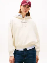 Buzo con capucha Tommy Hilfiger color crema, de corte amplio, con logo bordado en el pecho y cordones ajustables.