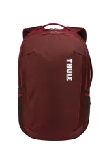 Mochila Thule Subterra de 30 litros color borgoña, con logo blanco estampado en el frente. Cuenta con compartimento acolchado para laptop de 15 pulgadas, bolsillo para tablet, PowerPocket para organizar cables y correas acolchadas para los hombros. Se puede sujetar a una maleta con ruedas.