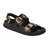 Sandalia Birkenstock modelo Cannes, color negro, con tiras ajustables de cuero y hebillas metálicas doradas. Cuenta con una tira trasera para mayor sujeción y plantilla anatómica.