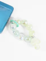 Llavero con cuentas redondas traslúcidas y dije colgante en forma de hongo. Incluye lámina para colgar del celular.