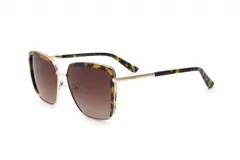 Lentes de sol Prune con marco dorado y detalles carey, lentes marrones degradé y patillas carey con detalle dorado.