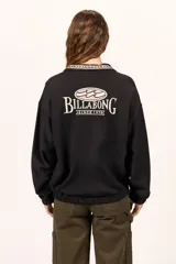 Buzo canguro Billabong color negro de manga larga, con cuello mao y diseño holgado. Cuenta con el logotipo de la marca estampado en la espalda.