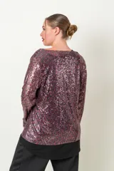 Blusa de fiesta con lentejuelas plateadas y verde esmeralda, forrada en viscosa, con escote en V y mangas tres cuartos.