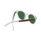 Lentes de sol Indie Zac con montura transparente redonda y lentes verdes.