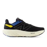 Championes de running New Balance Fresh Foam X 1080, color negro con detalles en azul y amarillo.
