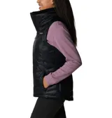 Chaleco acolchado Columbia en color negro, con cierre frontal completo, cuello alto forrado en vellón y bolsillos laterales con cierre. Presenta tecnología Omni-Shield que repele la humedad y aislamiento térmico sintético.