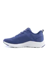 Championes deportivos de running Umbro modelo Volten para mujer, de color negro con suela blanca y base rosada, detalles en celeste y cordones negros.