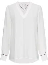 Blusa blanca de Tommy Hilfiger con cuello en V, mangas largas y puños abotonados.