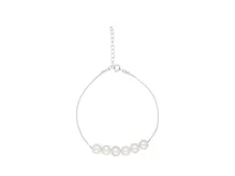 Pulsera de plata 925 con cadena fina y seis perlas de río centrales.