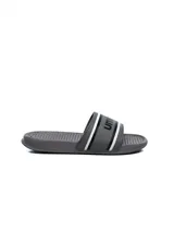 Ojotas grises de hombre con logo Umbro en la tira.