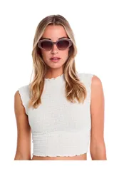 Lentes de sol Tiwi modelo Colette, con montura color beige y lentes marrones degradadas.