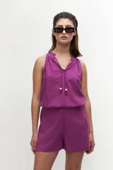 Short de lino color magenta, con bolsillos laterales.