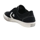 Championes urbanos Converse Stoke Ox de lona negra con logo lateral en blanco y suela de goma blanca.