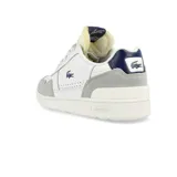 Zapatillas urbanas Lacoste modelo T-Clip 223, color blanco con detalles en gris y azul marino. Presentan el logo de la marca en el lateral y están confeccionadas en cuero y gamuza.
