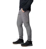 Pantalón técnico Columbia de corte ajustado, color gris, con paneles de diferente tonalidad en la parte inferior. Cuenta con cintura elástica ajustable con cordón y puños elásticos en los tobillos.