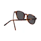 Lentes de sol Indie Firenze de acetato color carey con lentes polarizados grises y forma redonda.