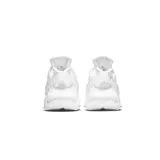 Championes Nike Air Huarache blancos, con ajuste tipo botín, clip icónico en el talón y suela de goma.