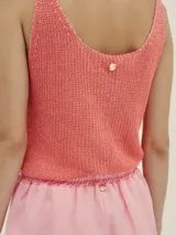 Musculosa tejida color salmón.