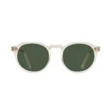 Lentes de sol Indie modelo Capri, con montura transparente y lentes redondas color verde oscuro.