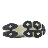 Championes New Balance 9060 unisex color crema con detalles en gris y azul.