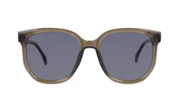 Lentes de sol con armazón de acetato en tono marrón translúcido y cristales oscuros. Diseño de forma redondeada con puente clásico.