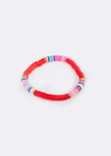 Pulsera elástica con gomitas de colores y detalles de mostacillas doradas.