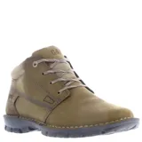 Botas de caña baja Caterpillar modelo Casual Convert, confeccionadas en cuero nobuck color beige arena. Presentan cierre con cordones, cuello acolchado y suela de goma robusta con costuras reforzadas.