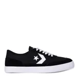 Championes urbanos Converse Net Star OX, color negro con detalles en blanco, confeccionados en lona y gamuza, con logo estrella característico en los laterales y suela de goma blanca.