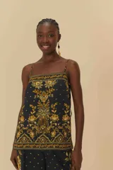 Top negro con estampado floral en tonos dorados, tirantes finos y amarre lateral.