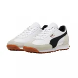 Championes Puma modelo Easy Rider Mix, en color blanco con detalles en negro, gris claro y suela de goma marrón con tacos. Cuenta con la franja característica de la marca en el lateral y el nombre en tono dorado.