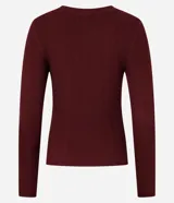 Suéter de punto acanalado color beige, con cuello redondo y mangas largas. Confeccionado en tejido tricot con textura suave y ajuste al cuerpo.