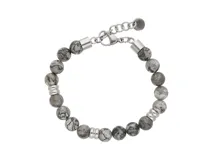 Pulsera de acero con diecisiete piedras de jaspe gris larvikita intercaladas con separadores de acero.