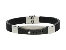 Pulsera de goma negra con apliques de acero plateado y cierre de hebilla.