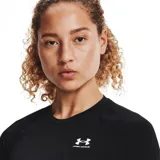 Remera de compresión Under Armour HeatGear de manga larga, color negro con logo blanco en el pecho y cuello redondo con inscripción de la marca.