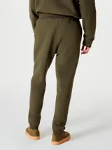 Pantalón deportivo tipo babucha de corte ajustado, con cintura elástica con cordón de ajuste y puños acanalados en los tobillos.