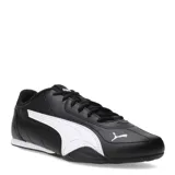 Championes urbanos Puma modelo Catch, color negro con detalles en blanco. Presentan un diseño de perfil bajo con el logo de la marca en el lateral y en la puntera, confeccionados en material sintético resistente con cierre de cordones.