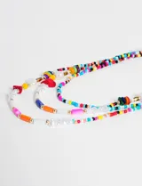Collar largo de cuentas de colores, perlas y detalles dorados.