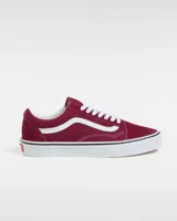 Championes Vans modelo Old Skool, color bordó con la icónica banda lateral blanca. Presentan capellada de gamuza y lona, cierre con cordones blancos y suela de goma vulcanizada con diseño tipo waffle.