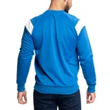 Buzo deportivo Umbro Drill, color azul con detalles en blanco en los hombros y logo de la marca en el pecho.