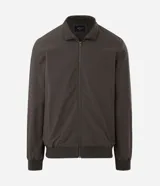Campera bomber Marfinno para hombre, de color negro, confeccionada en poliamida con elastano y forro de poliéster. Cuenta con cuello alto, cierre frontal por cremallera y elástico en puños y cintura.