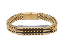 Pulsera de acero con baño de oro, eslabones gruesos y diseño central con cuadrados negros y plateados. Cierre con broche a presión.