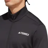 Campera Adidas Terrex de hombre, color negro, con cierre frontal y cuello alto. Logo de Adidas Terrex estampado en blanco en el pecho.