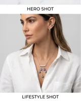 Collar de acero con cadena fina y dije central compuesto por una barra horizontal de la que cuelgan cinco dijes pequeños con el símbolo del ojo turco en azul, blanco y negro.