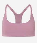 Top deportivo de microfibra color beige, con escote redondo y diseño de espalda nadadora.
